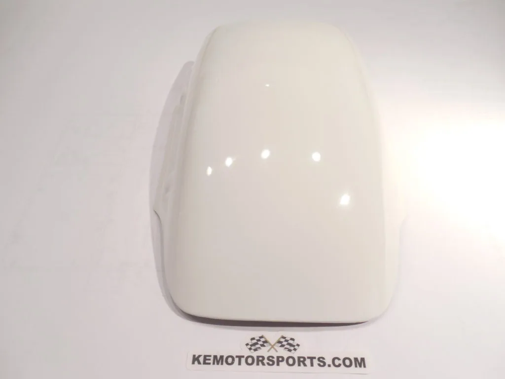 White helmet visor or protective shield with rounded shape and glossy finish, mounted against white background