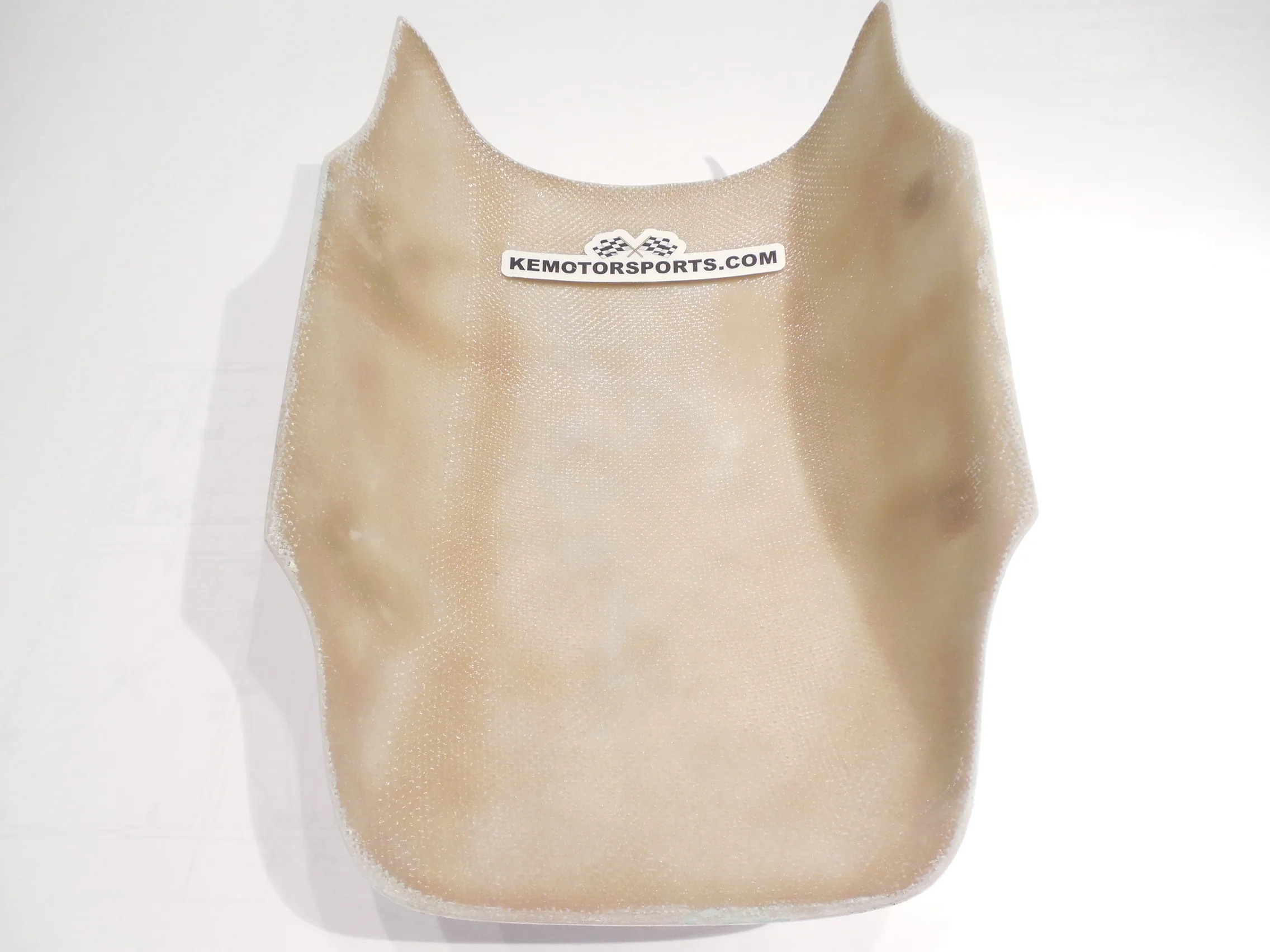 Cream-colored mesh bib with KEMOTORSPORTS.COM label against white background