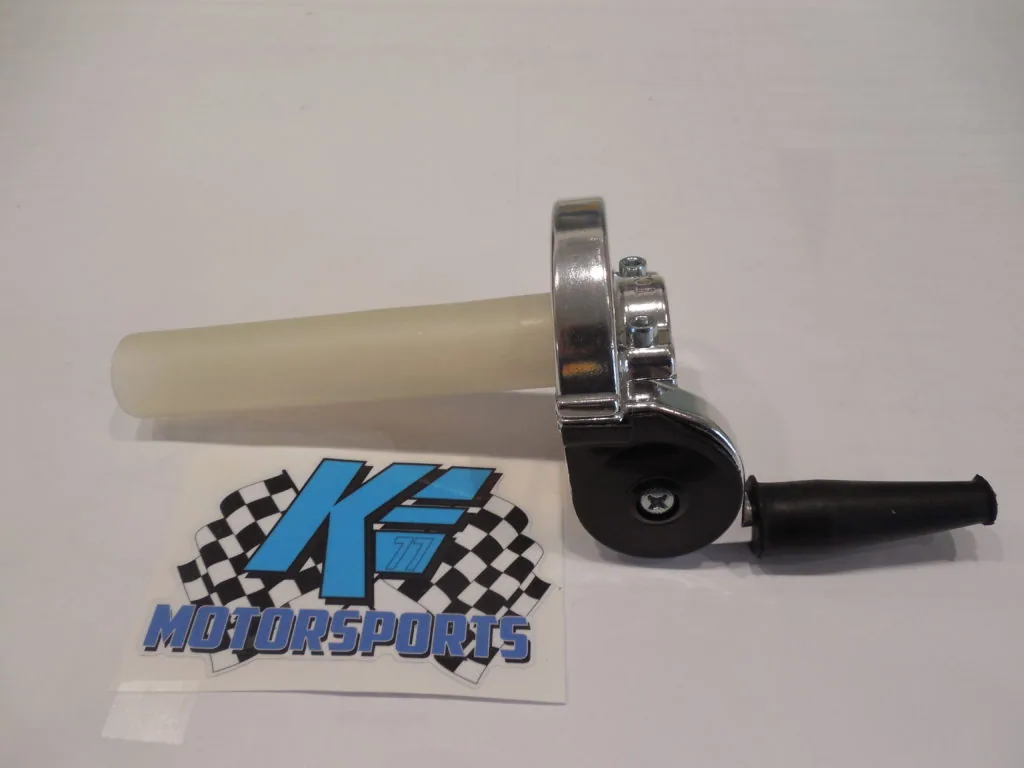 Throttle grip assembly with cream-colored tube, chrome and black metal components, and black rubber handle next to K.E. Motorsports sticker.