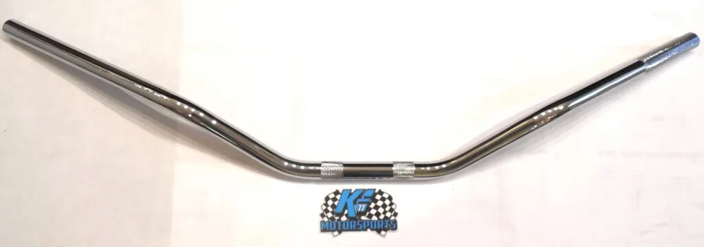 Chrome curved handlebar with white grip sleeves and blue motorsports logo badge centered below