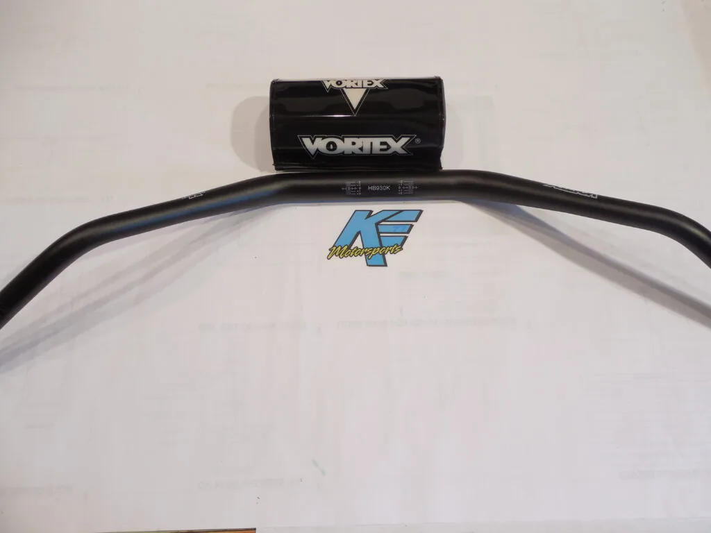 Black handlebars with Vortex clamp and blue K4 logo on white surface