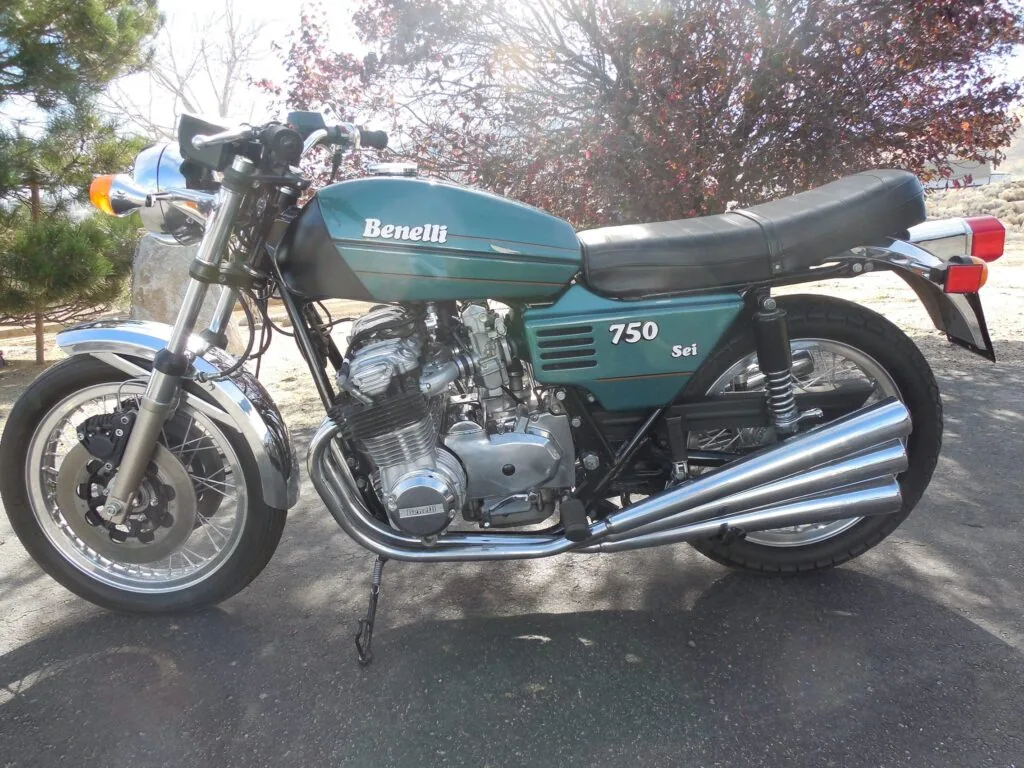Green Benelli 750 Sei street bike parked on a driveway